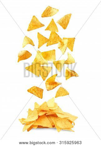 Delicious Mexican Nachos Chips Falling Into Pile On White Background