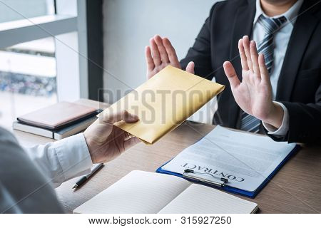 Anti Bribery And Corruption Concept, Business Man Refusing And Don't Receive Money Banknote In Envel