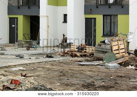 Construction Site With Building Materials And Dirty Mess