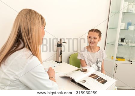 Dnepr / Ukraine - 04.23.2019: Doctor Trichologist Conducts Consultation With A Young Girl Patient.