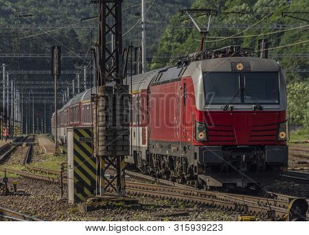 Red Slovakia Train In Kysak Station In East Slovakia In Summer Morning