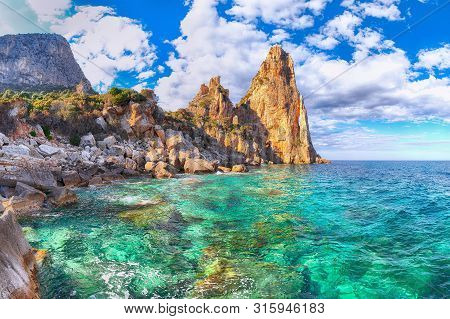 Spectacular View Of Punta Pedra Longa And Azure Water In Sea. Location: Baunei, Province Of Nuoro, S
