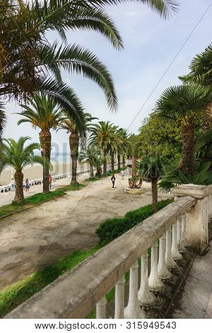 Gagra, Abkhazia - 02 May 2019: View From The Colonnade On Ardzinba Avenue Towards The Sea And The Se