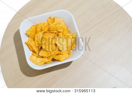 The Corn Chip On Wooden Table With White Background