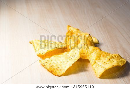 The Many Piece Of Corn Chip On Wooden Table