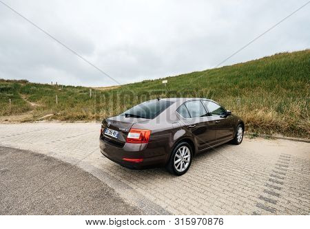 Overveen, Netherlands - Aug 16, 2018: Rear View Of New Skoda Octavia Parked On A Beach Park Space In