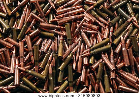Different Ammo On Wooden Background, Weapon Concept.