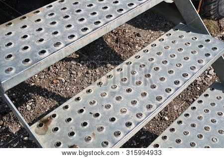 Stairs With Antislip Steps Of Perforated Metal At Construction Site