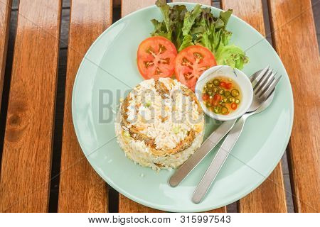 Top View Of Hot Tasty Fried Rice With Snake Skin Gourami Dish