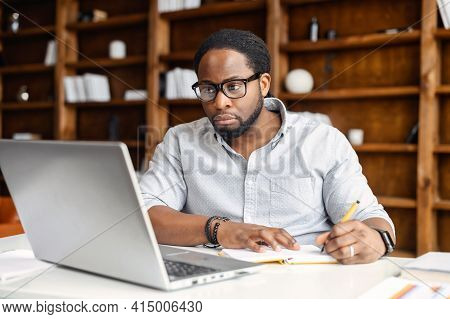 Business Planning, E-learning Concept, Casual African American Business Man Writing On Notebook And 