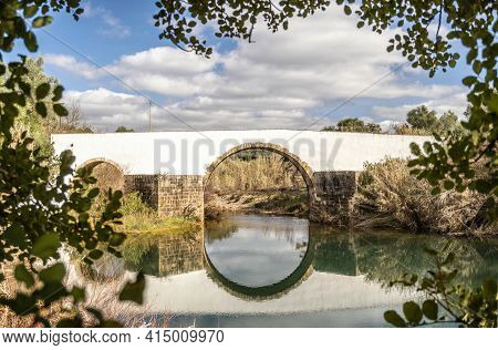 Roman Bridge Over A Small River In Loule, Algarve, Portugal