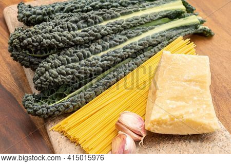 Cooking With Black Flat Leaves Of Cavolo Nero Tuscan Cabbage
