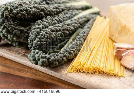 Cooking With Black Flat Leaves Of Cavolo Nero Tuscan Cabbage