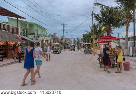 Tourists On A Sandy Road In Holbox Island, Quintana Roo, Mexico