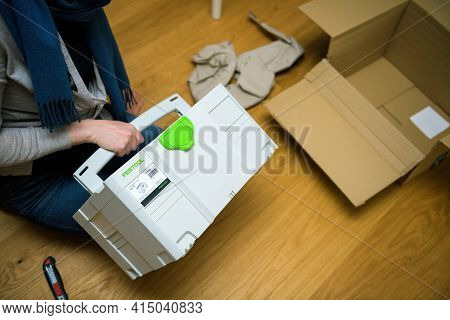 Paris, France, - Dec 18, 2020: Woman Unboxing Festool Systainer Sys-3 Tl Storage Solution From The G