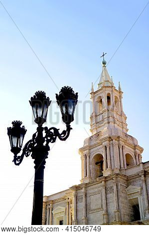 Gorgeous  White Volcanic Stone Bell Tower Of Basilica Cathedral Of Arequipa With Vintage Black Iron 