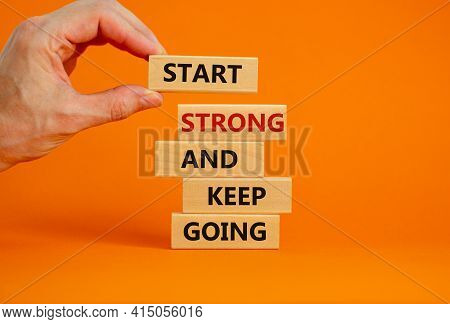 Start Strong And Keep Going Symbol. Concept Words 'start Strong And Keep Going' On Wooden Blocks On 