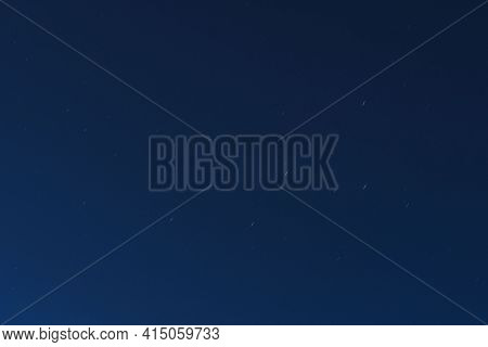 Beautiful View Of Defocus Of Falling Stars Cassiopeia сonstellation In The Night Sky.
