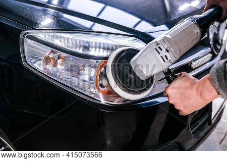 Car Headlight Cleaning Polishing Machine At Car Service At Shallow Depth Of Field