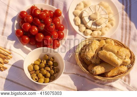 Summer Outdoor Picnic With Cherry, Rollini, Cheese, Olives