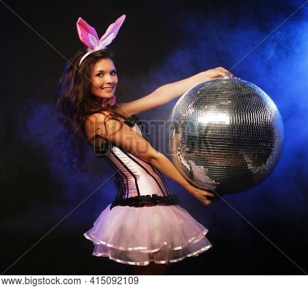 Young Woman Jolding Disco Ball, Ready For Party, Bunny Coctume.