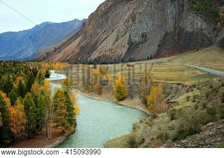 Bend A Beautiful Turquoise River With A Picturesque Autumn Valley At The Foot Of A High Mountain.