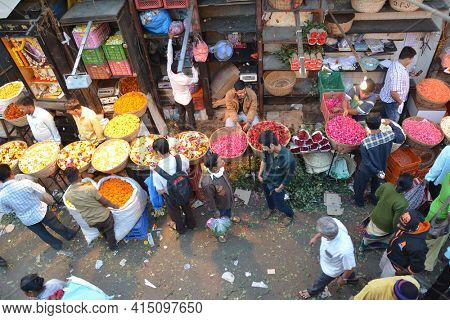 MUMBAI, INDIA - JANUARY 11, 2017: Mumbai Flower Market. The Dadar Flower Market opens at 4am is filled with vendors offering their wares to shop owners, decorators and florists.