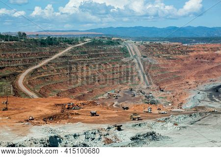 Mining Dump Trucks Working In Coalmine , Used As A Source Of Electricity Generation In The Country.