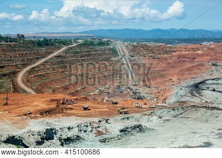 Mining Dump Trucks Working In Coalmine , Used As A Source Of Electricity Generation In The Country.
