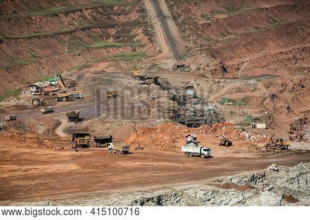 Mining Dump Trucks Working In Coalmine , Used As A Source Of Electricity Generation In The Country.