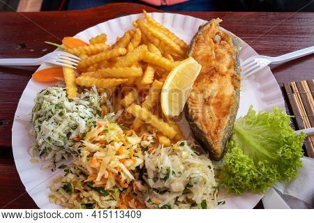 Fried Fish With Fries And Vegetable Salad