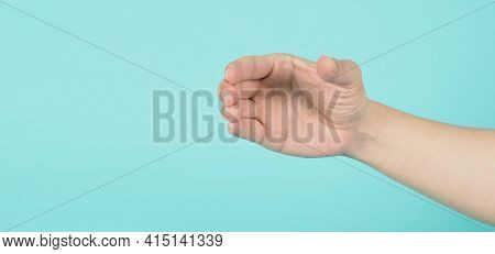 Empty Hand Holding Or Catch Nothing Guesture On Green And Blue Or Mint Background.