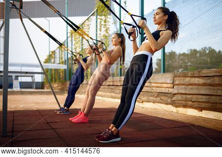 Sportive women, outdoors group training