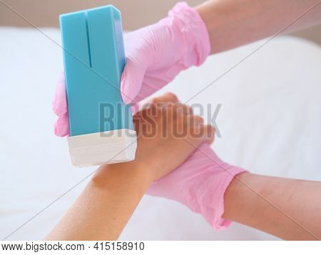 Waxing Salon Or Spa. Hair Removal Using Wax.Concept - sugar paste or hair removail.
