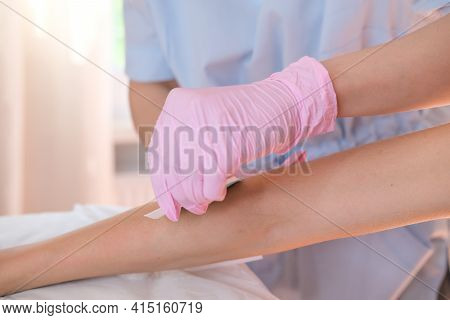 Waxing Salon Or Spa. Hair Removal Using Wax.Concept - sugar paste or hair removail.