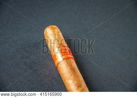 Paris - France - March 23, 2021 : Brown Partagas Cuban Cigar Isolated On Grey