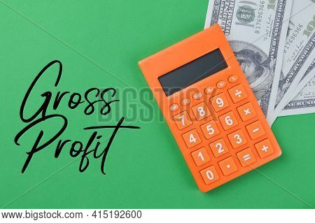 Top View Of Calculator And Money Banknotes With Text Gross Profit
