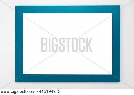 Horizontal Frame Mockup. Isolated On White Background. White Poster With Cyan Frame Mockup. Man Hand