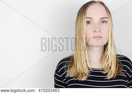 The Girl Looks In Front Of The Mirror At Her Oily Hair. Problematic Scalp And Increased Secretion Of