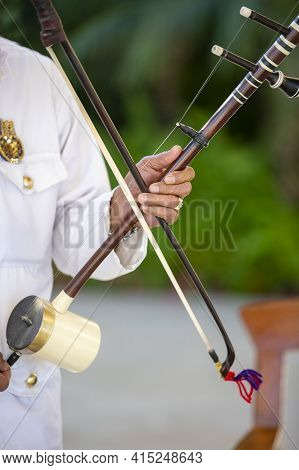 Spike Fiddle, Tro, Being Played By A Musician At A Cambodian Wedding Ceremony