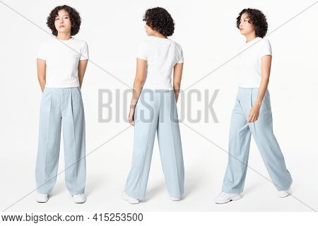Woman in white tee and blue loose pants minimal fashion