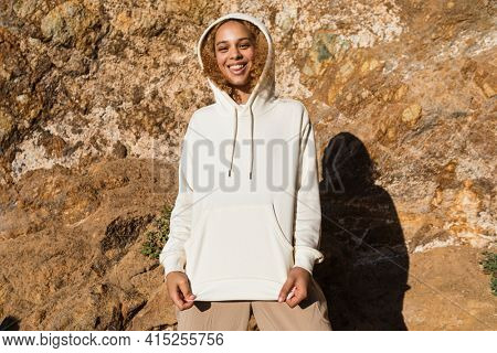 Beautiful woman in white hoodie winter fashion