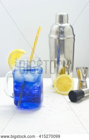 Hawaiian Blue Lagoon Summer Alcoholic Cocktail With Ice In Glass Jar. Bartender Equipment Shaker, Ji