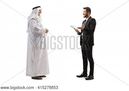 Full length profile shot of a young businessman talking to a mature arab man isolated on white background