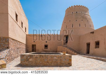 Courtyard Of A Small Medieval Arabian Fort In Bukha, Oman. Stairs And Square Tower. Hazy Day In Arab