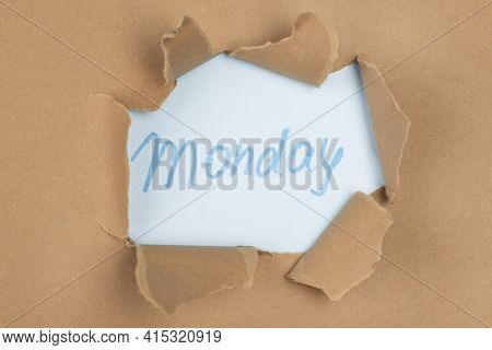 Top View Of Paper Tear With Monday. High Quality And Resolution Beautiful Photo Concept