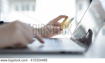 Online product purchase, Businesswoman use laptop register via credit cards to make online purchases