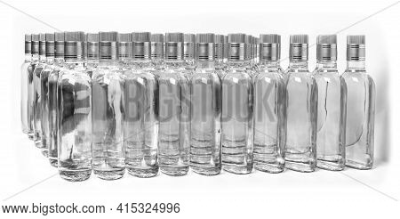 Multitude Of Pure Alcohol Bottles Not Labeled. Bottles Of Home Alcoholic Beverages Isolated On White