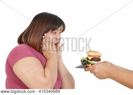 Fat Asian Woman Wearing Exercise Clothes To Lose Weight, Happy Posture, Someone Gave Her Hamburger. 