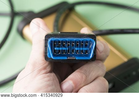 Electrician Holds In Hands Computer Car Diagnostic Error Scanner Obd2 Plug. Equipment, Diagnostic In